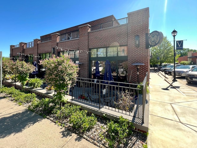 view of front of house featuring brick siding