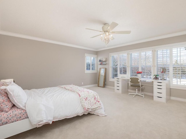 bedroom featuring a ceiling fan, light colored carpet, crown molding, and baseboards