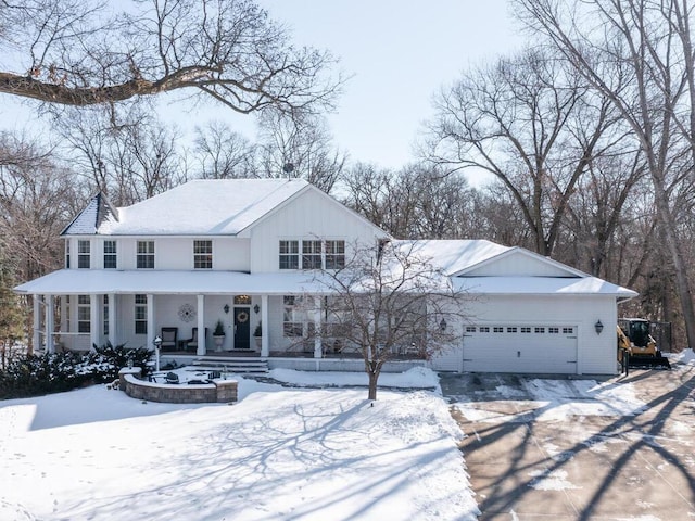 view of front of house featuring covered porch and an attached garage