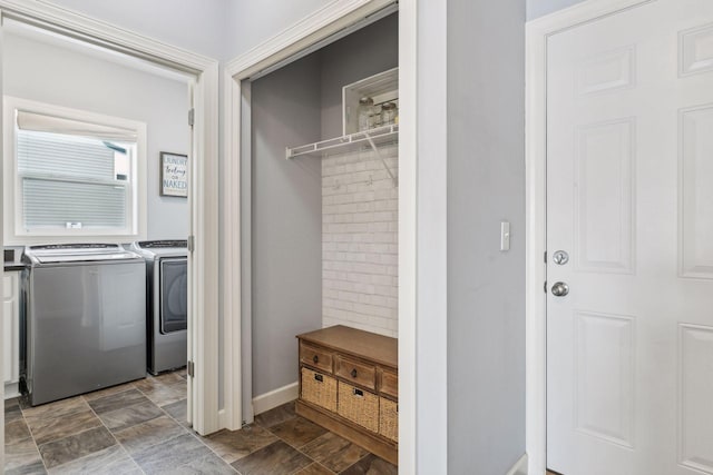 clothes washing area with washer and dryer