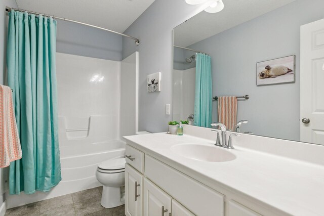 full bathroom featuring shower / tub combo with curtain, toilet, vanity, and tile patterned flooring