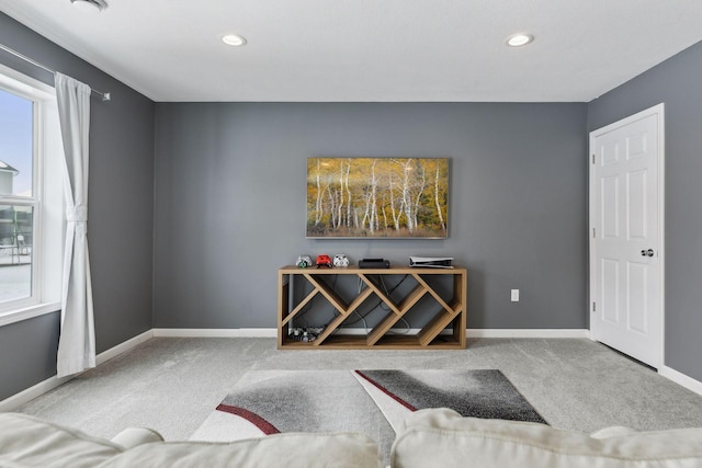 sitting room featuring light carpet