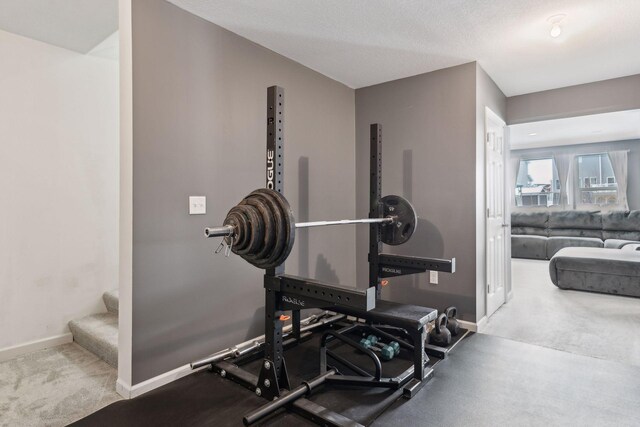 exercise room with a textured ceiling