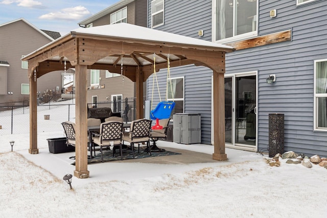 snow covered patio with a gazebo