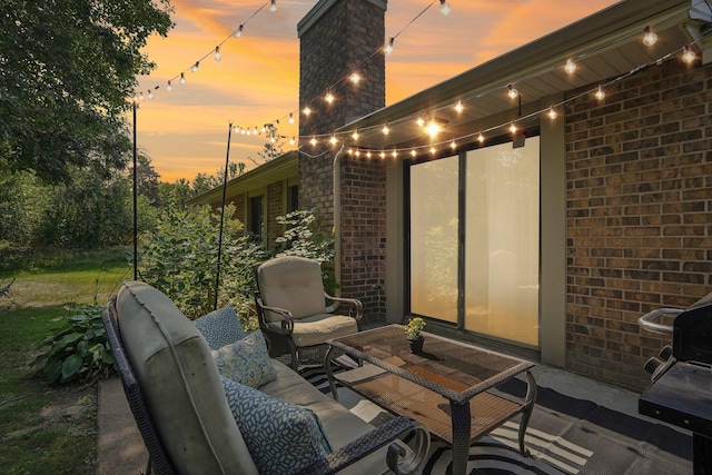 view of patio terrace at dusk