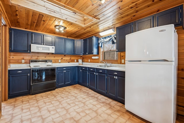 3313 Twin Island Cir NW, Prior Lake, MN 55372 - kitchen with white appliances, wood ceiling, light countertops, light flooring, and wooden walls