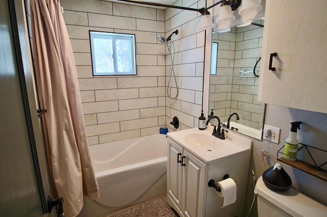 full bathroom with toilet, vanity, and shower / tub combo with curtain