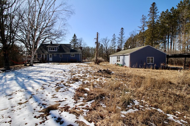 view of yard covered in snow