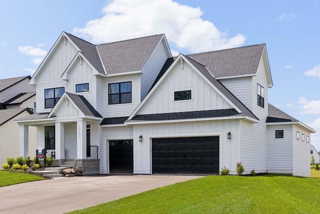 view of front of house featuring a garage and a front yard