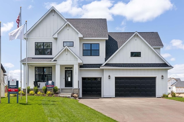 view of front facade with a garage, a porch, and a front lawn