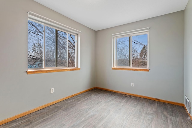 unfurnished room featuring hardwood / wood-style floors