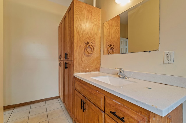 bathroom featuring tile patterned flooring and vanity