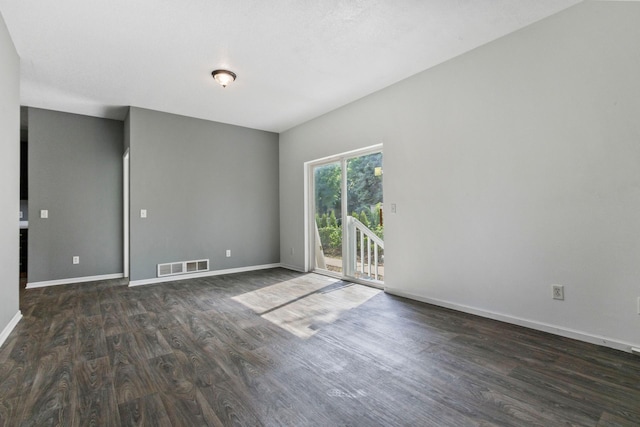 unfurnished room featuring dark wood-type flooring