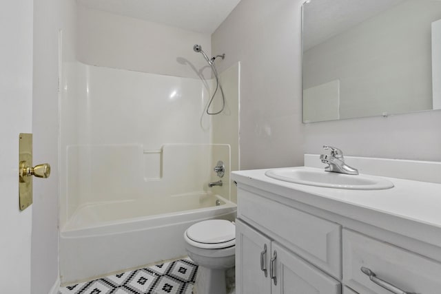 full bathroom with toilet, vanity, and shower / washtub combination