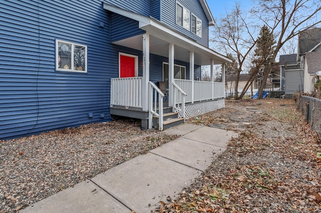 doorway to property featuring covered porch