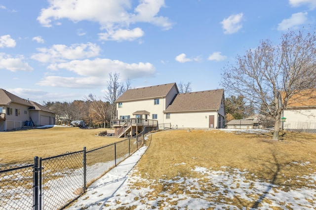 exterior space featuring stairs, a yard, a fenced backyard, and a wooden deck