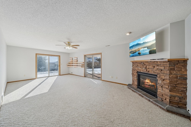 living area featuring light carpet, plenty of natural light, a stone fireplace, and baseboards