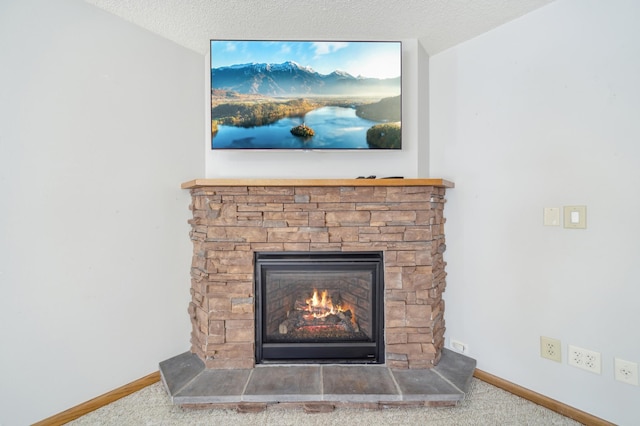 details featuring carpet, a fireplace, and a textured ceiling