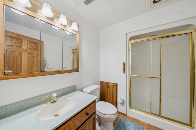 full bathroom with visible vents, toilet, a stall shower, vanity, and a textured ceiling