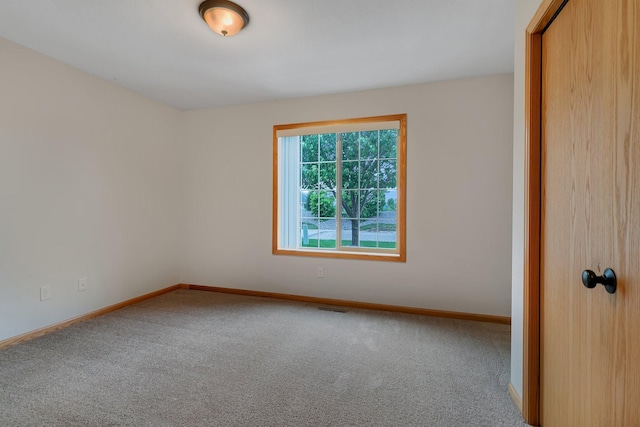 611 Cottonwood Ave, Litchfield, MN 55355 - empty room featuring carpet flooring and baseboards
