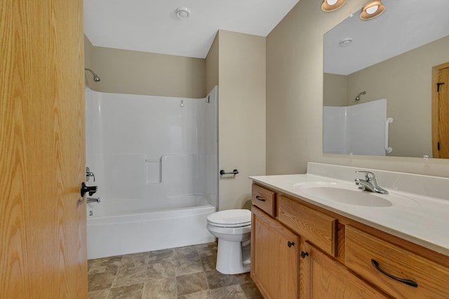615 Cottonwood Ave, Litchfield, MN 55355 - bathroom with toilet,  shower combination, vanity, and stone finish floors