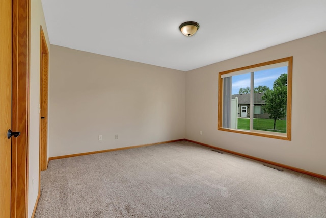 615 Cottonwood Ave, Litchfield, MN 55355 - unfurnished room with carpet floors and baseboards