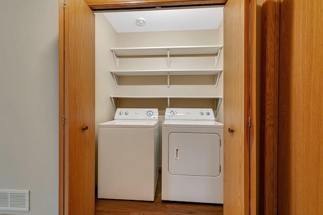 615 Cottonwood Ave, Litchfield, MN 55355 - laundry room with washer and dryer and wood finished floors