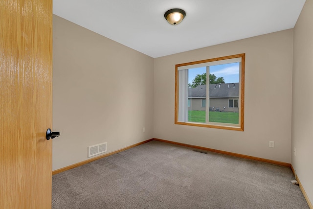615 Cottonwood Ave, Litchfield, MN 55355 - carpeted spare room featuring baseboards