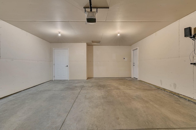615 Cottonwood Ave, Litchfield, MN 55355 - garage featuring a garage door opener