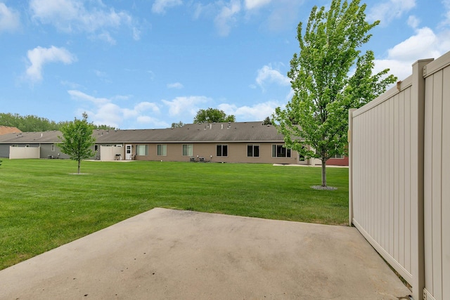 615 Cottonwood Ave, Litchfield, MN 55355 - rear view of property with a patio and a lawn