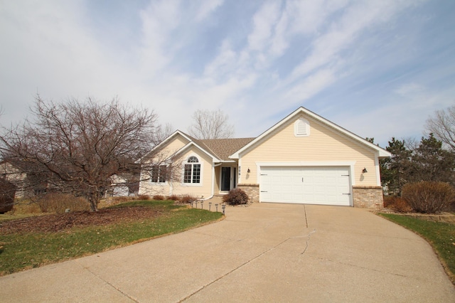 ranch-style house with concrete driveway, a garage, and brick siding