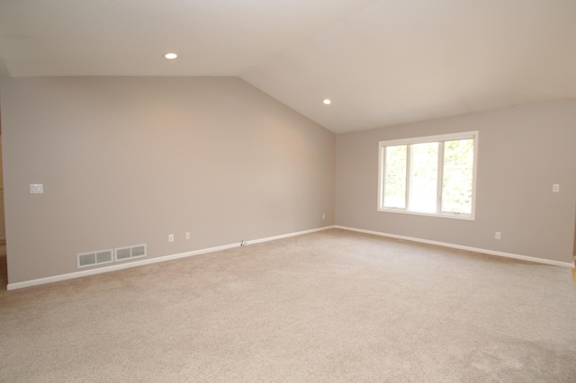 unfurnished room with recessed lighting, visible vents, baseboards, and vaulted ceiling