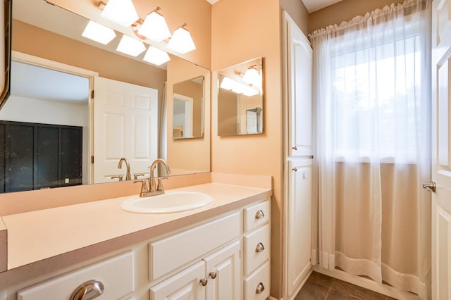 bathroom with tile patterned flooring and vanity