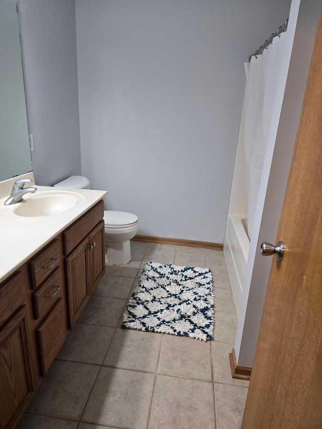 full bathroom featuring vanity, shower / bath combo, tile patterned floors, and toilet