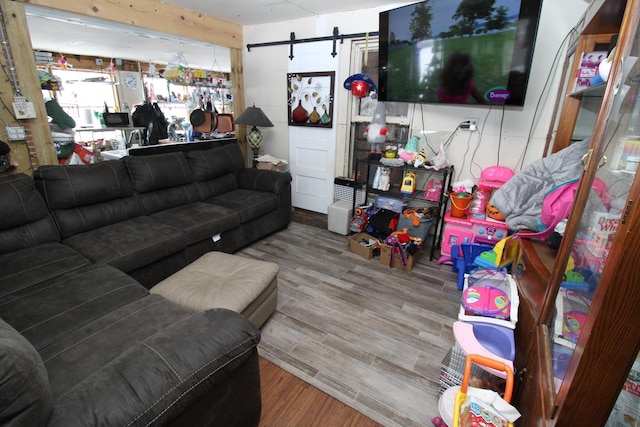 living room featuring hardwood / wood-style flooring and a barn door