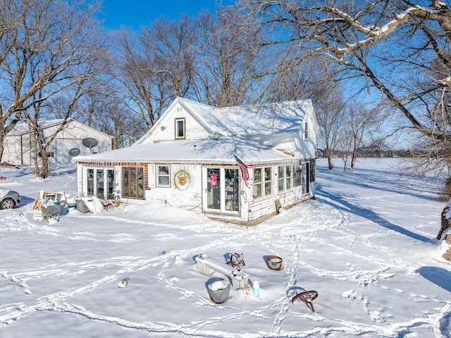 view of front of property featuring a sunroom