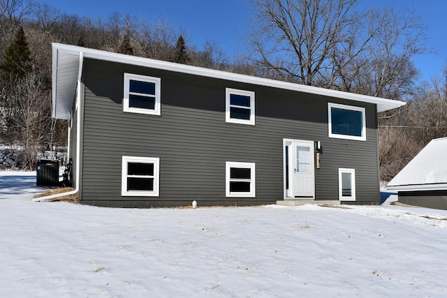 split foyer home featuring central AC unit