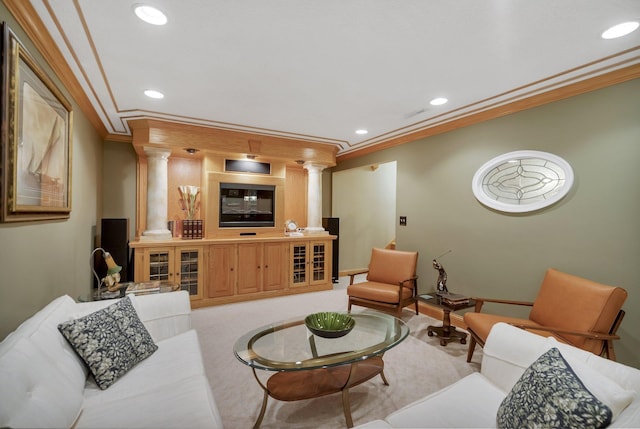 carpeted living room featuring ornamental molding and decorative columns