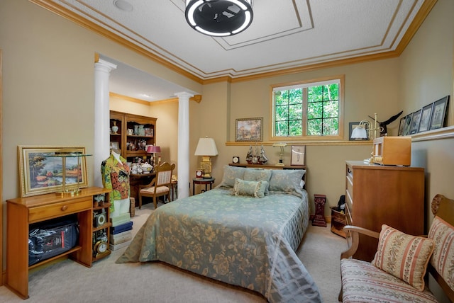 carpeted bedroom featuring decorative columns and crown molding