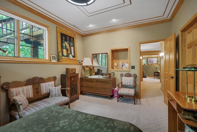 sitting room with ornamental molding and light colored carpet