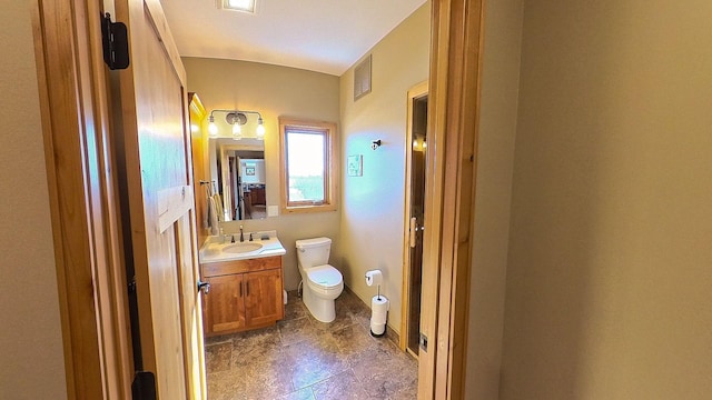 bathroom with visible vents, toilet, and vanity