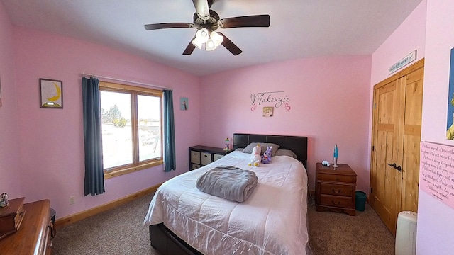 carpeted bedroom featuring lofted ceiling, a ceiling fan, and baseboards