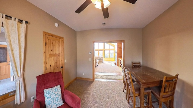 dining space with ceiling fan, baseboards, and carpet