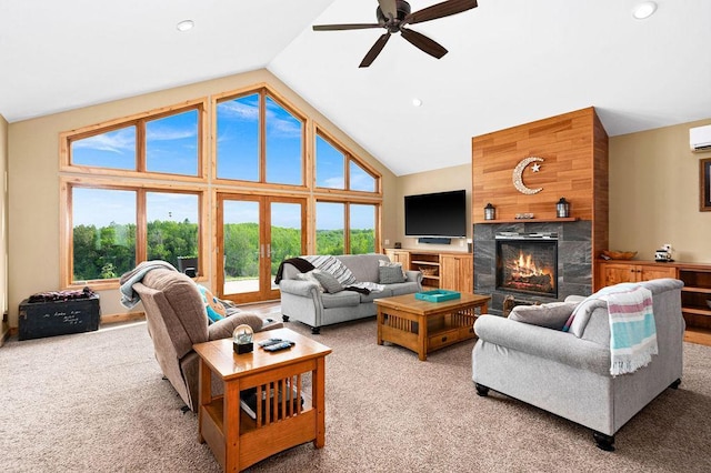 1036 Ziebarth Rd, Wrenshall, MN 55797 - living area with light colored carpet, ceiling fan, a fireplace, a wall mounted AC, and recessed lighting