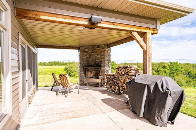 1036 Ziebarth Rd, Wrenshall, MN 55797 - view of patio / terrace with an outdoor stone fireplace and area for grilling