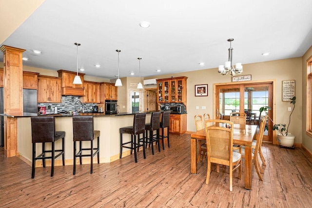 1036 Ziebarth Rd, Wrenshall, MN 55797 - dining area with recessed lighting, light wood finished floors, a chandelier, and french doors