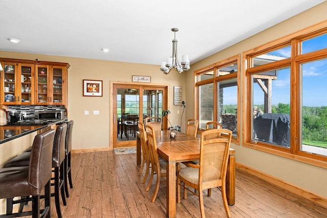 1036 Ziebarth Rd, Wrenshall, MN 55797 - dining area featuring light wood-type flooring, a chandelier, and recessed lighting
