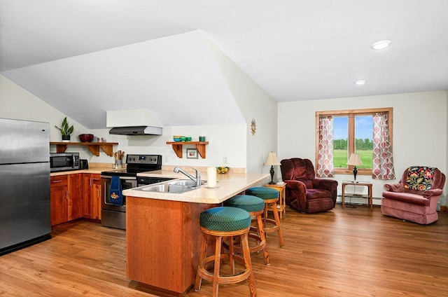 1036 Ziebarth Rd, Wrenshall, MN 55797 - kitchen with stainless steel appliances, a baseboard radiator, a peninsula, open shelves, and light wood-style floors