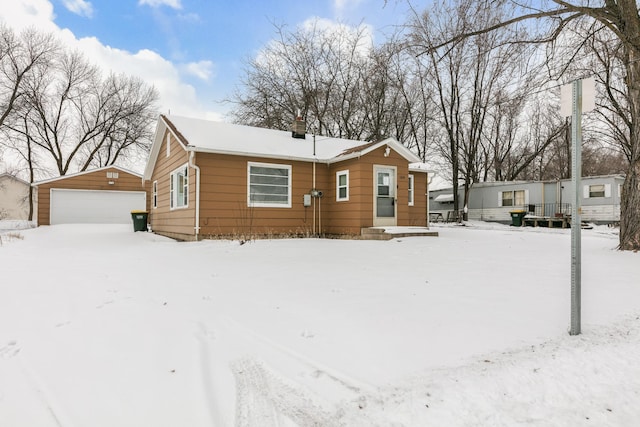 view of front of property featuring an outbuilding and a detached garage