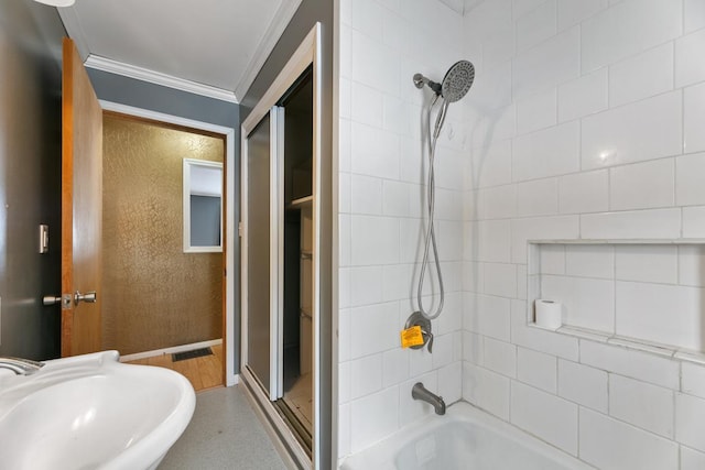 full bath featuring shower / bathtub combination, visible vents, a sink, and ornamental molding